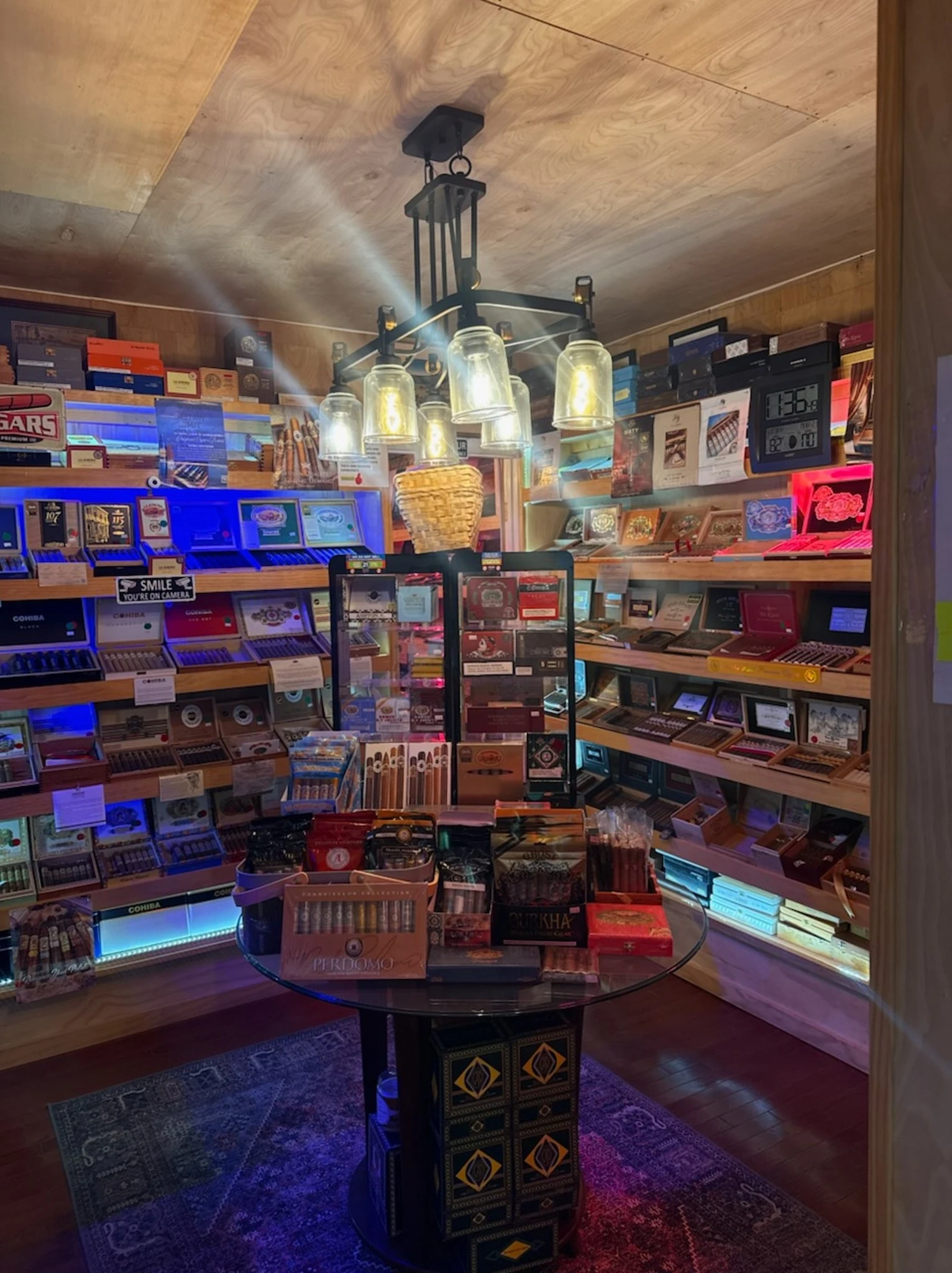 Cigar display shelves and humidor room inside Reston Cigars & Vapes